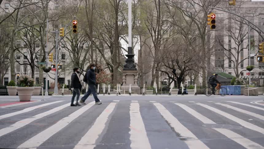 People are crossing the street in the city