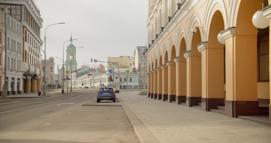Lone car parked on street in empty downtown during pandemic