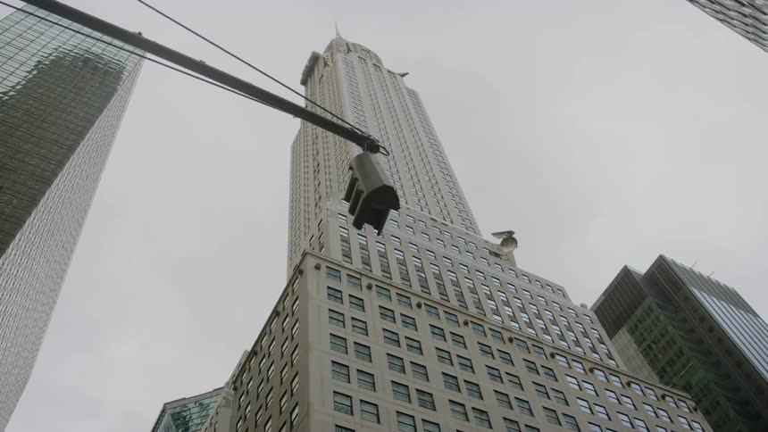 Skyscrapers tower over traffic light