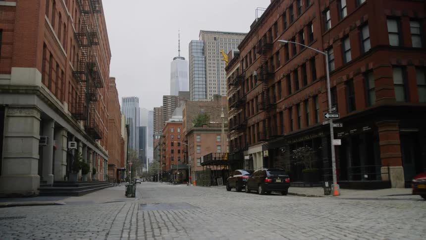An intersection near red brick buildings during the day