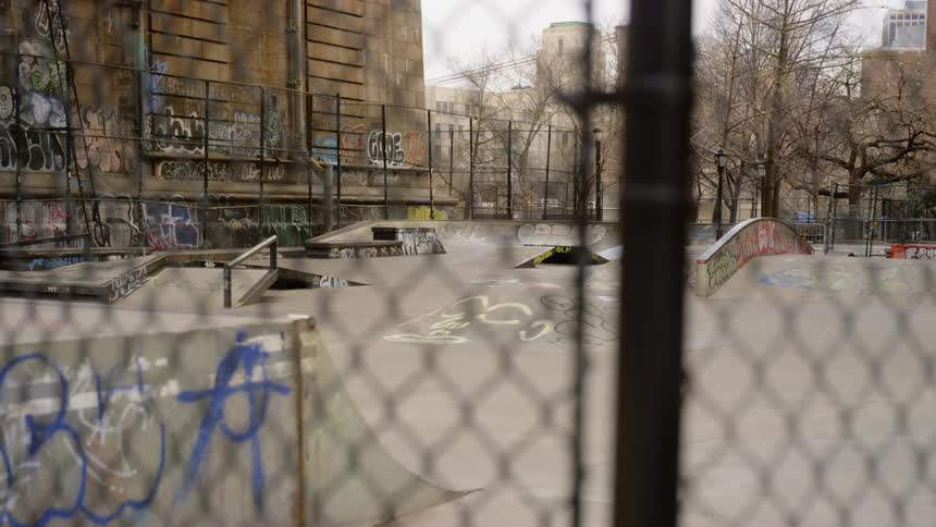 A empty skateboard park in a city