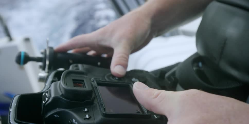 A person operates a large controller
