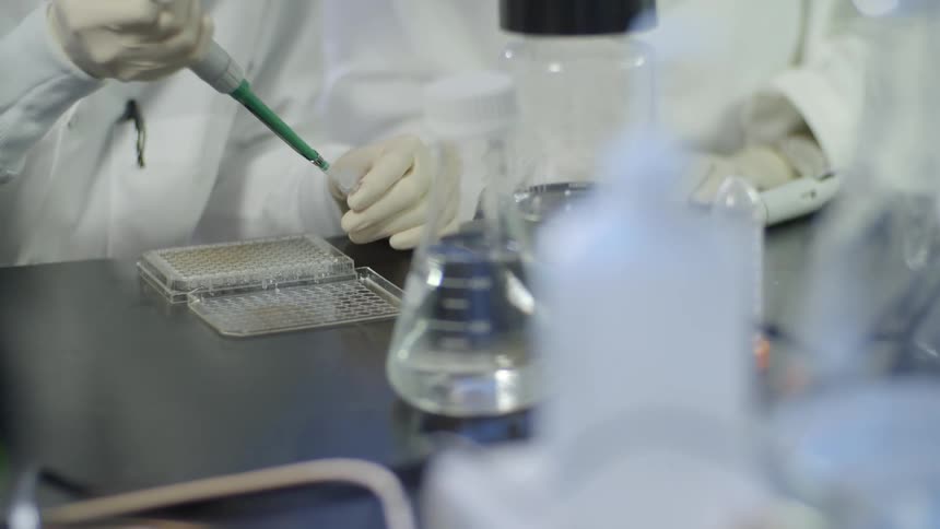 People are working in a lab together with instruments