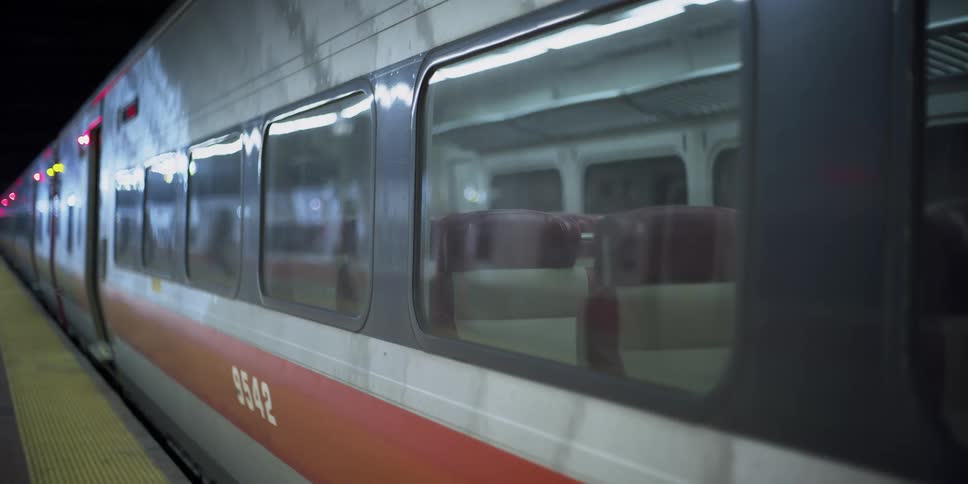 An empty railcar sits at a stop
