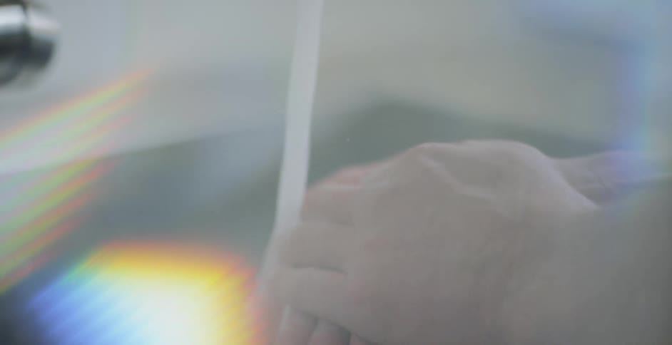 A person is washing their hands with a bar of soap and water