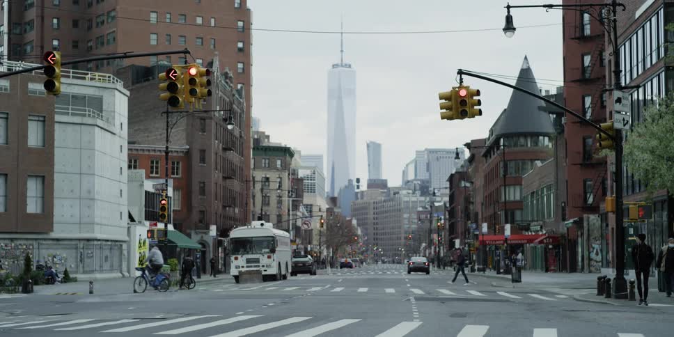 Downtown block has few pedestrians and traffic on the street