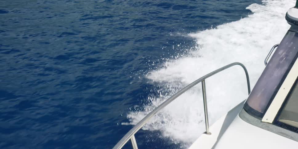 Water splashes as a boat travels