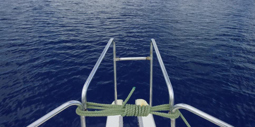 Point of view shot of boat going across blue waters
