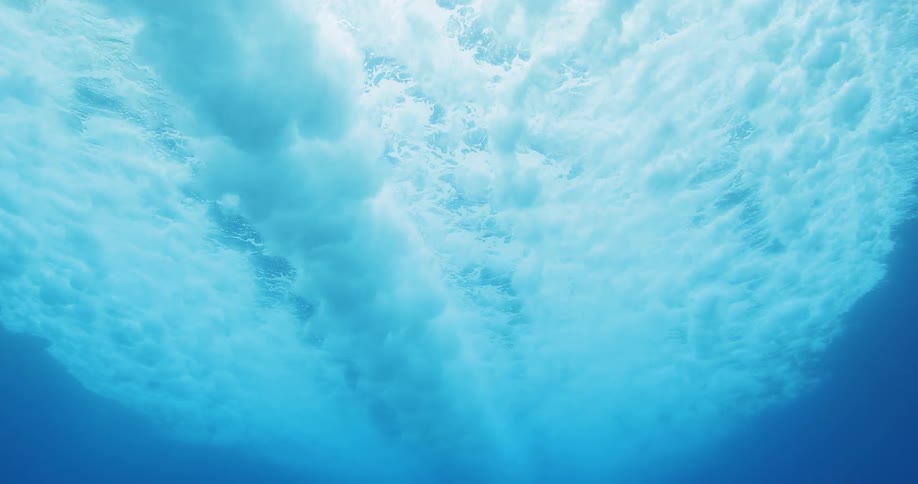 A boat in the ocean as seen from below