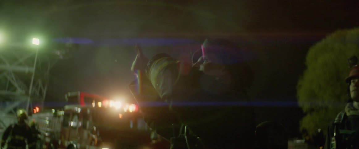 Firefighters work in the night