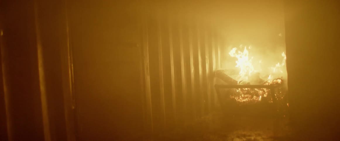 The fire is burning in the hall filling the area with smoke