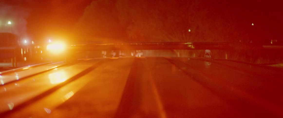 On top of a vehicle with emergency lights flashing