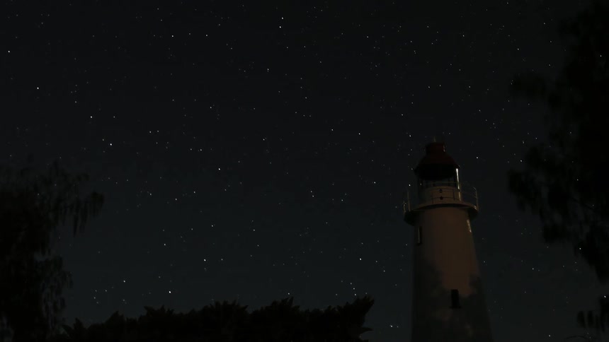 Photographer On Beach By Lighthouse
