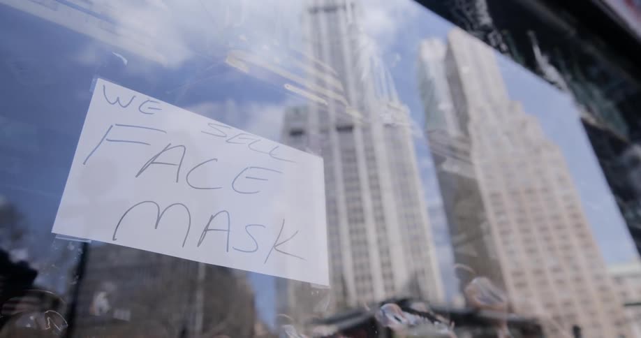 A sign in the window of a store