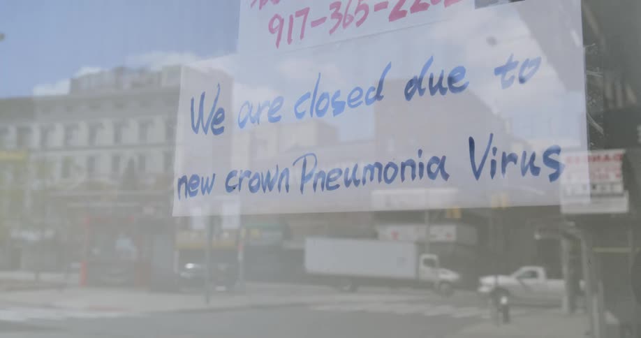 Closed sign on store showcase due to covid19