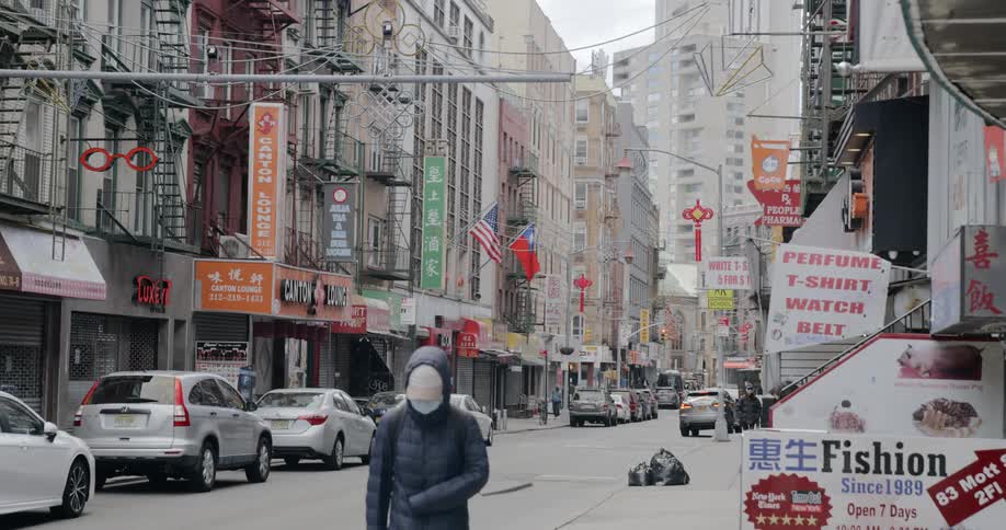 People walk down a closed city street