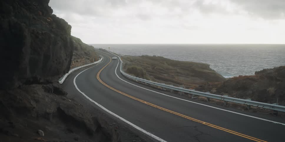 A car drives around the winding road