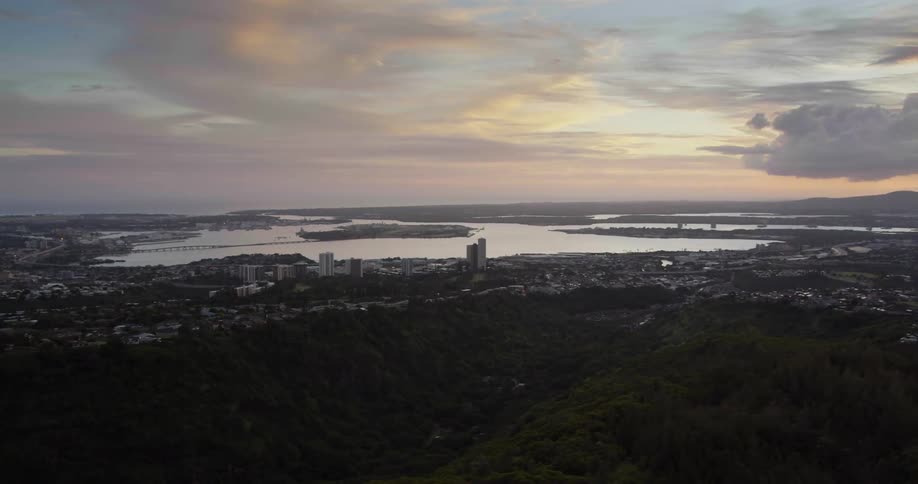 The sun is setting on the city on the hills
