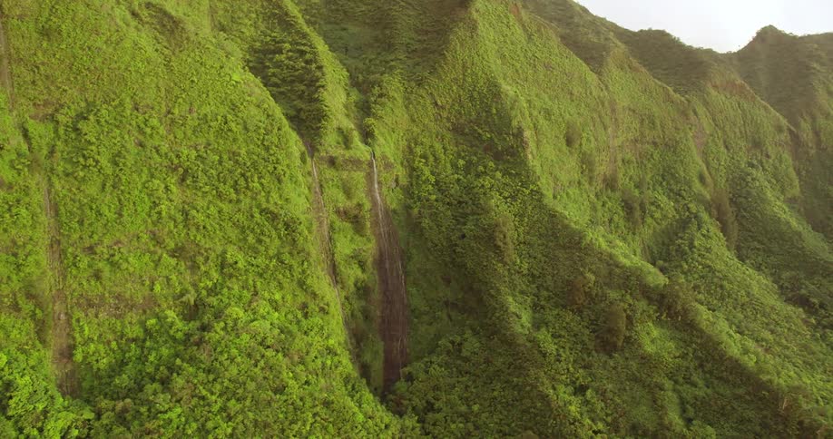 Waterfalls rushing down a hillside
