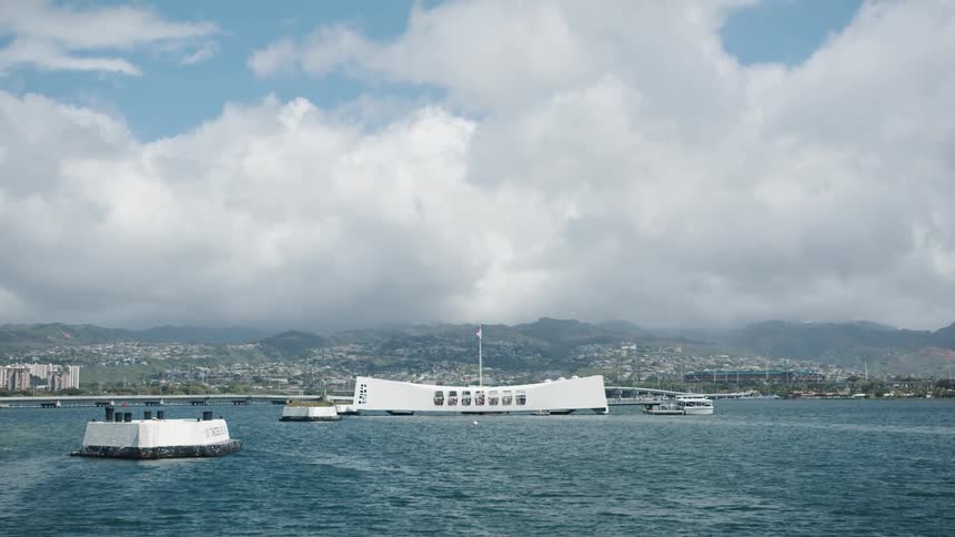 Aerial of pearl harbor monument from middle of ocean