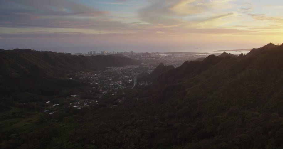 Rolling hills with the city skyline in the distance