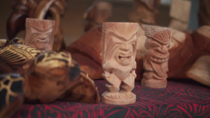 Small carved figures on cloth covered table
