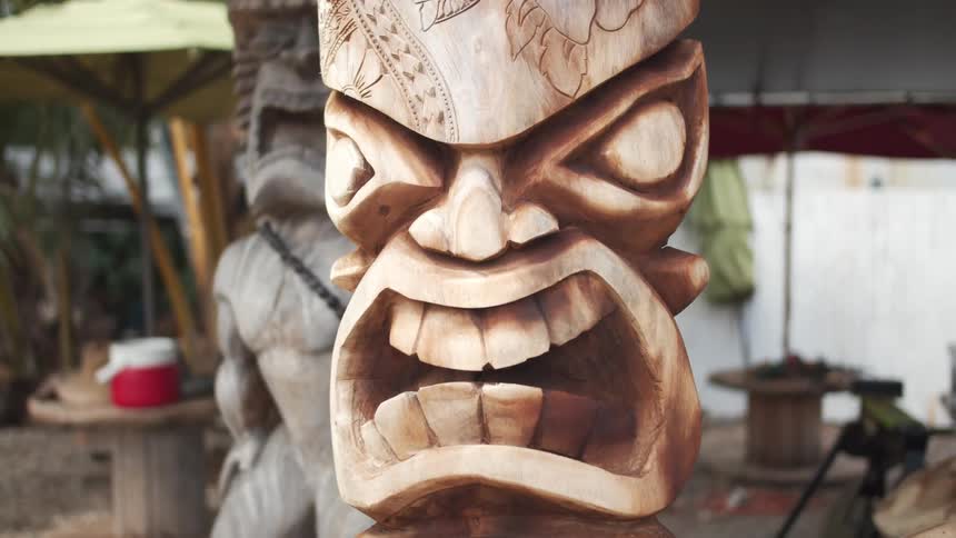 Wooden carved totems and sculptures in a yard