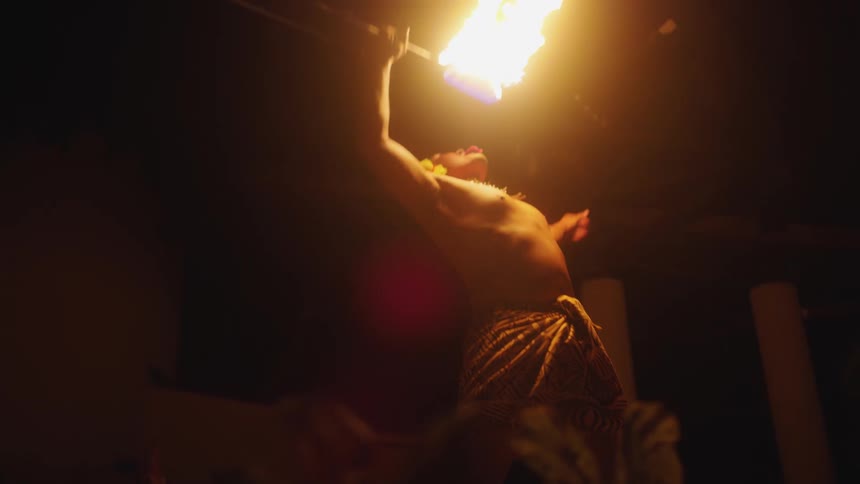 Traditional samoan fire dancer at night