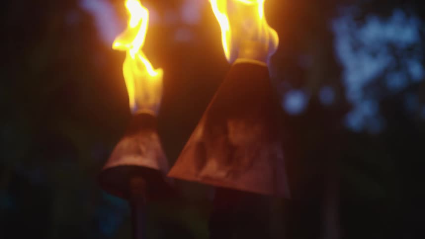 Flames rise out of torches