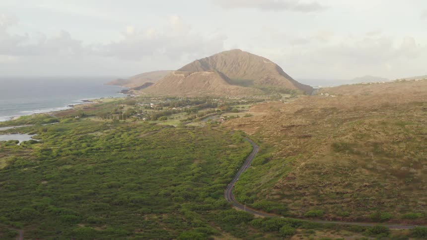 The green fields lead to the ocean