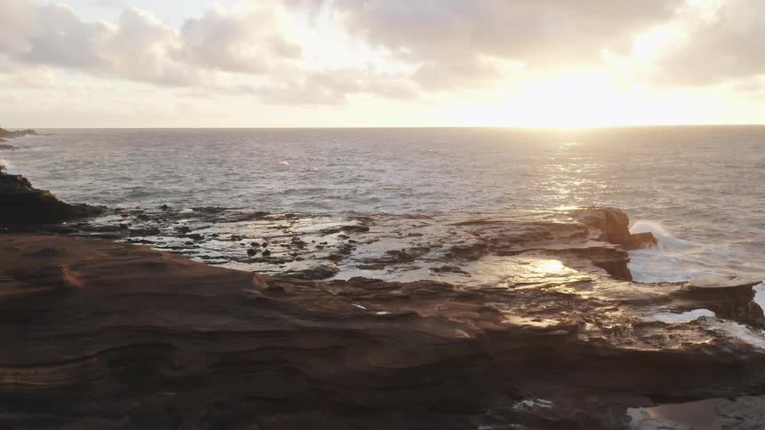 Waves rolling in to the rocky shoreline