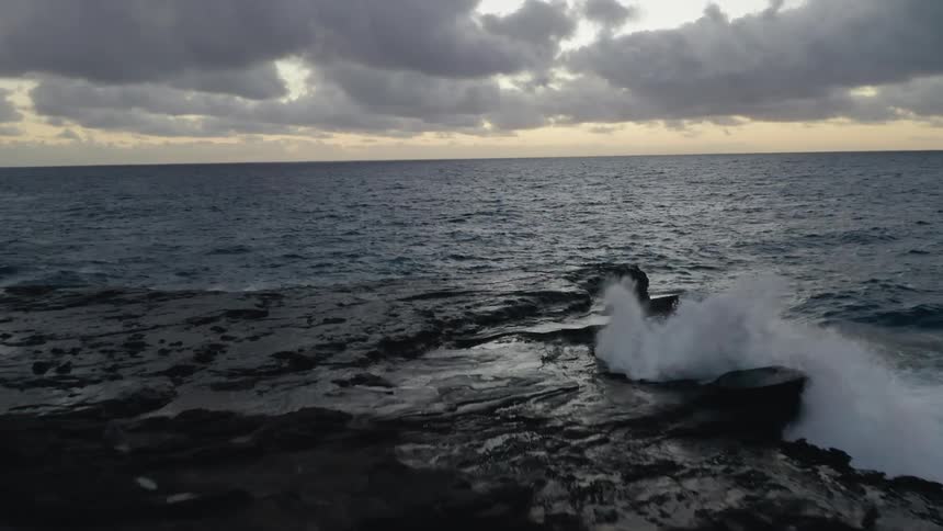 Waves crashing in to the rocks on the shore