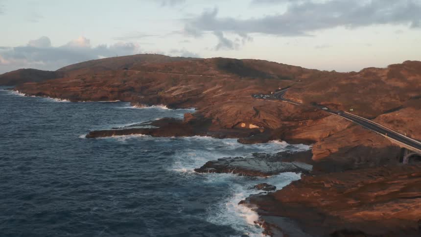Coastal road next to sea at day