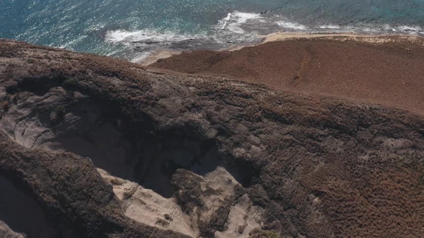 The mountain is on the edge of the ocean