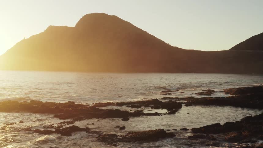 A rocky bay shore in the early morning