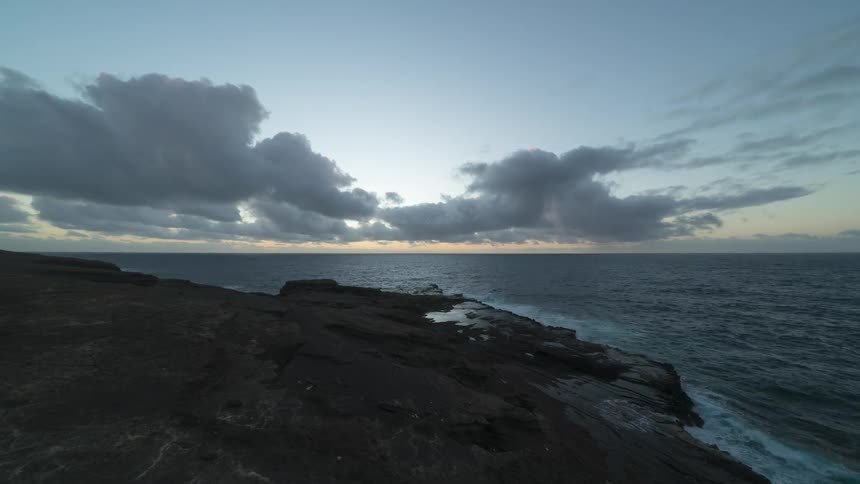 The sun rises over the ocean