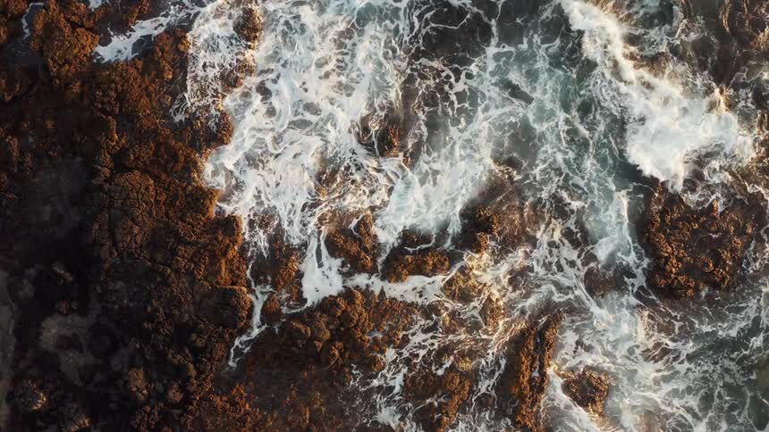 Waves crash on a rocky beach