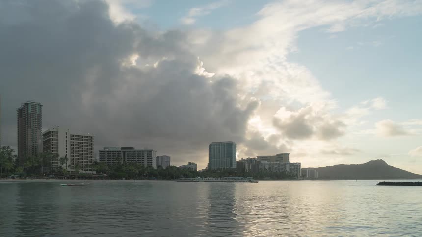 A city near the coast with the sky and clouds in the background