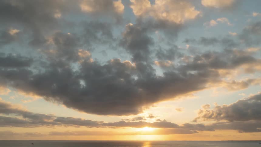 Time lapse of sun setting over the ocean