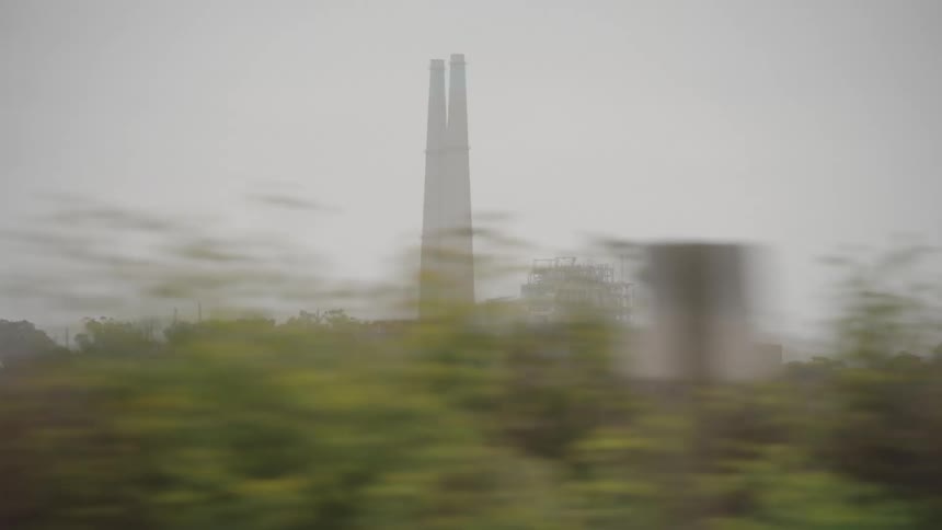 A factory with two chimney on the distance