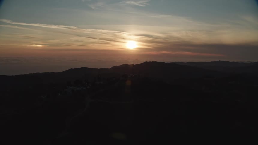 The sun sets in the distance
