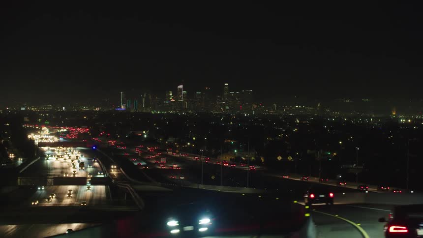 Many cars drive down the highway