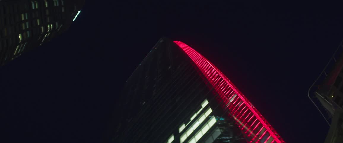 Buildings with lights with the sky above