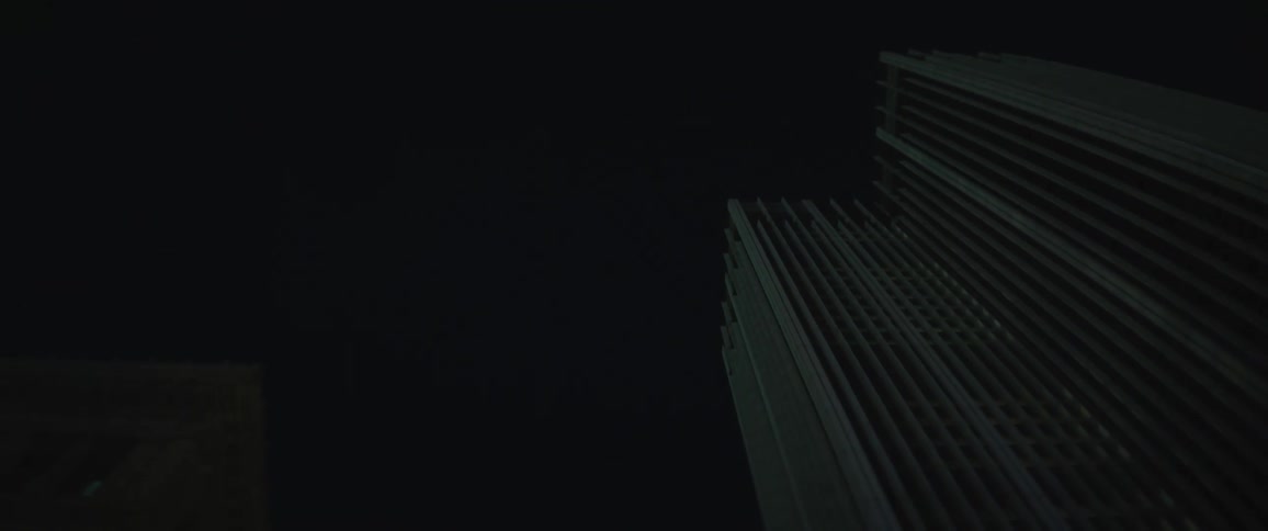 Tall buildings in city downtown at night