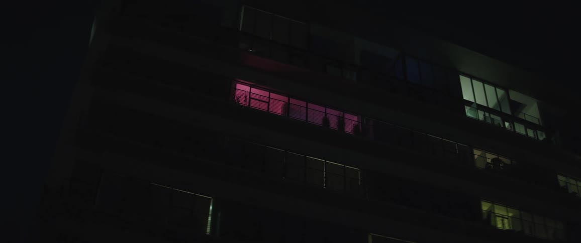 Colorful lights in apartment building at night