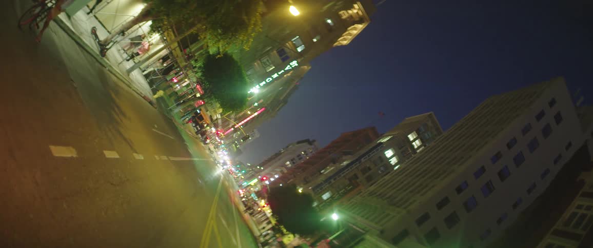 A street in a busy metropolis at night