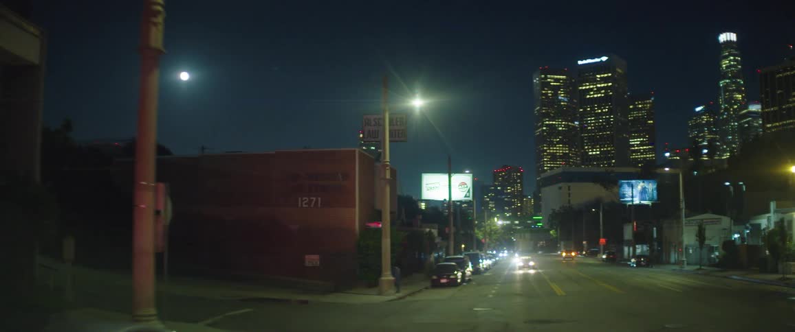 Cars drive near downtown