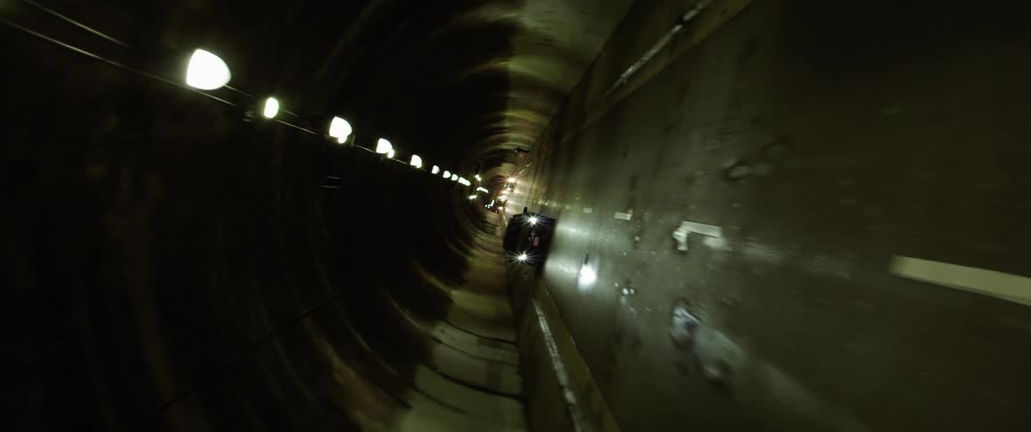A car drives through a tunnel