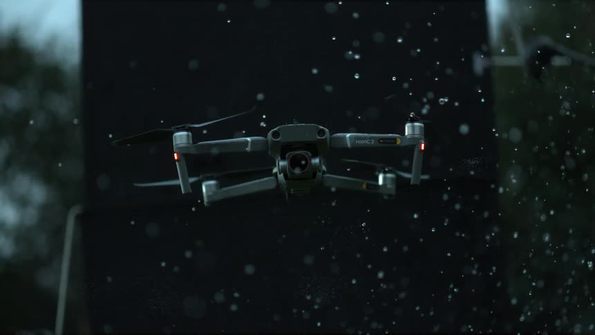 Slow motion footage of drone floating on rain