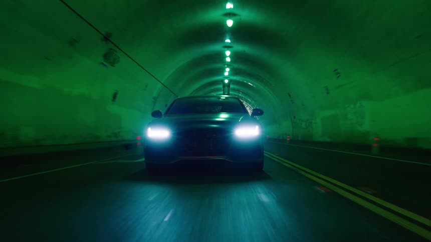 Car drives through a tunnel